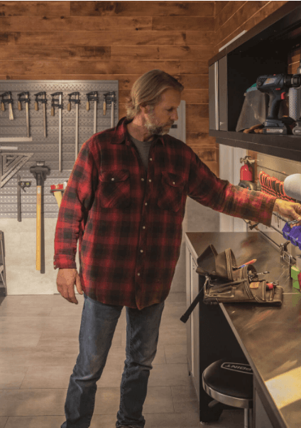 image of a man using newageproducts cabinet systems