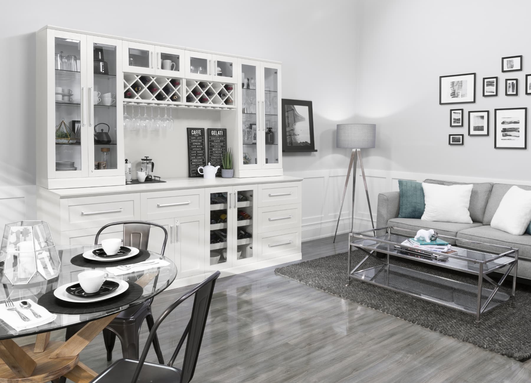 A finished white home bar wall unit with wine storage in a furnished living and dining room.
