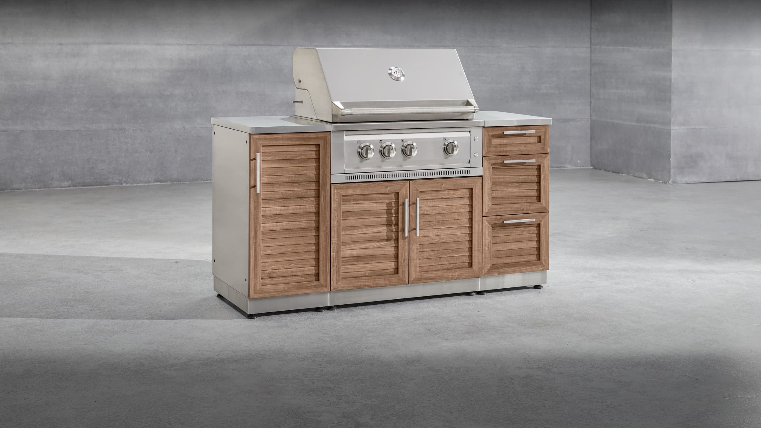 NewAge modular grill island with a built-in stainless steel gas grill and wood-look louvered cabinet doors