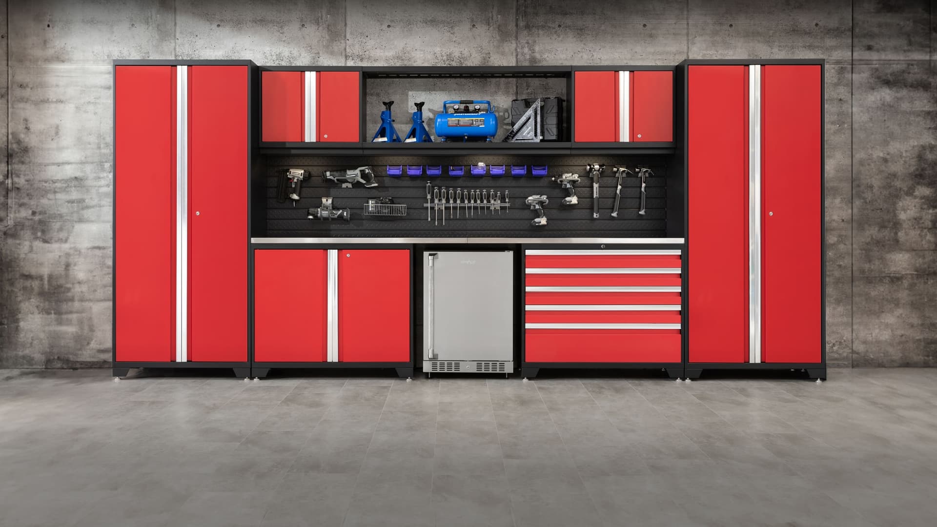 NewAge red garage cabinet set with tall lockers, a pegboard and a drawer tool chest