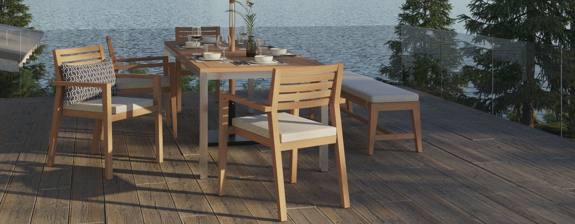 Teak outdoor dining table and chairs set for a meal on a lakeside deck
